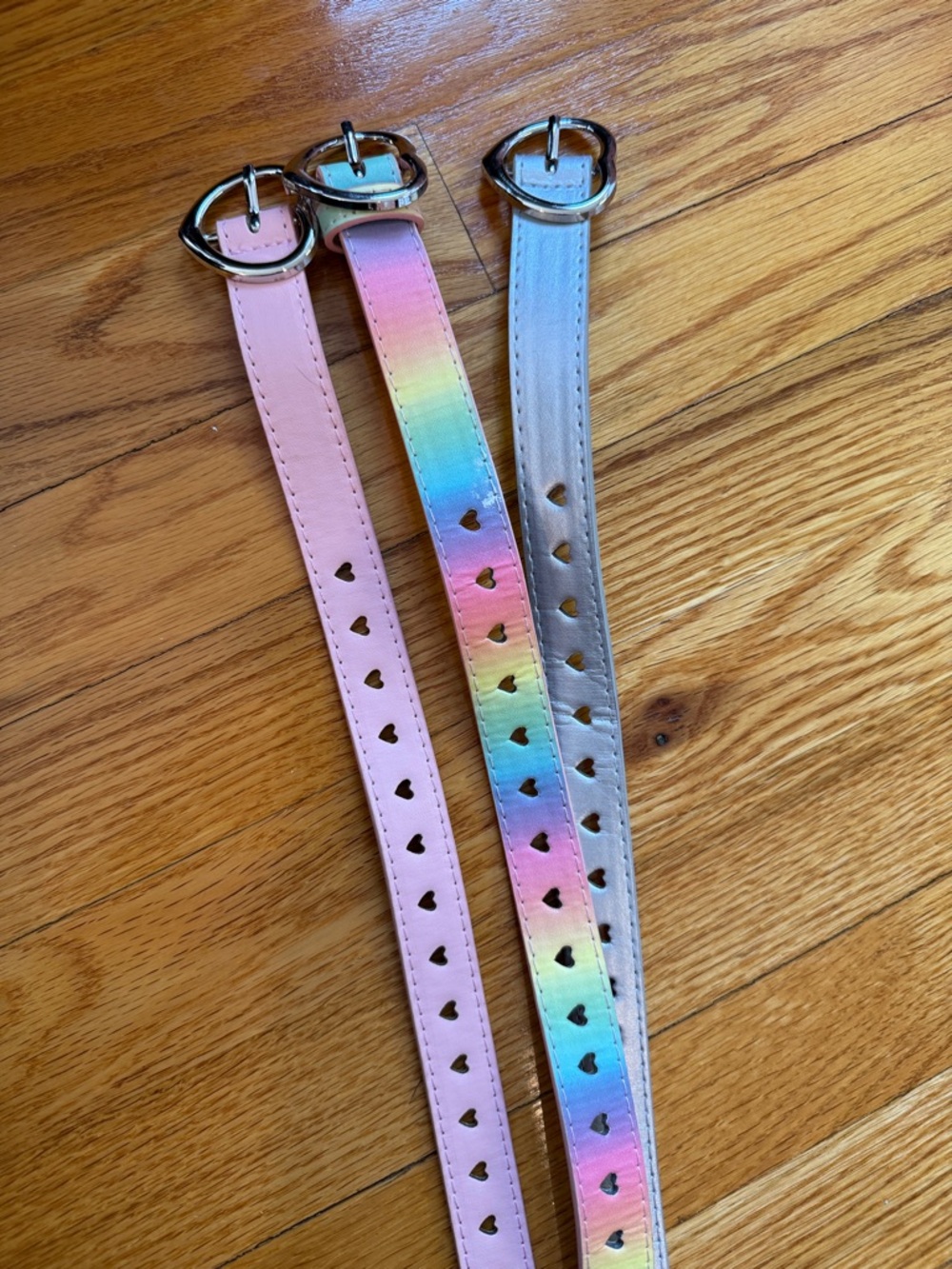 Set of 3 Heart-Punched Belts in Pastel Pink, Rainbow, and Metallic Silver